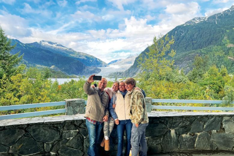 Take a picture in front of Mendenhall Glacier